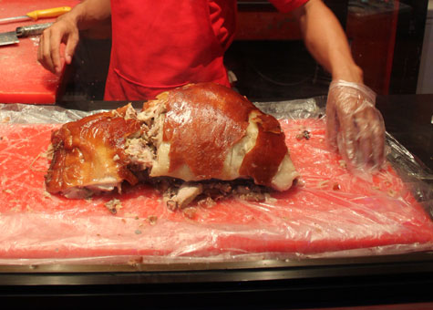 Chopping up lechon at Ayer Lechon in Cebu