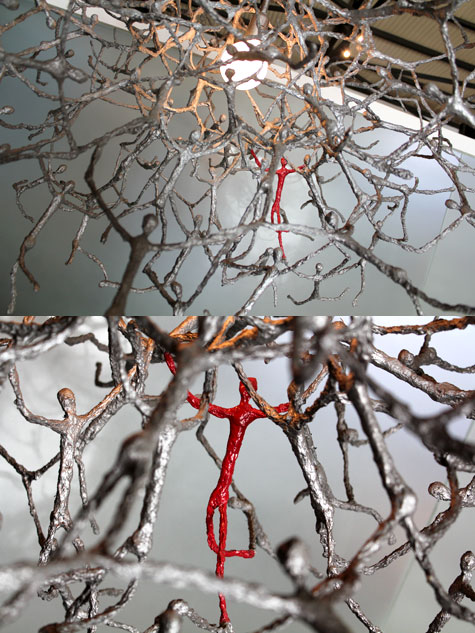 Human figures forming a chandelier