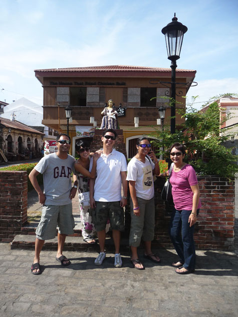 Posing in front of a statue