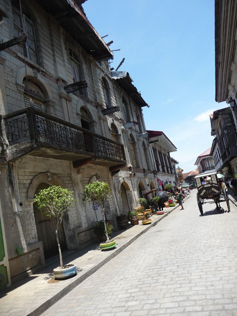 Cobble stone street with kalesa