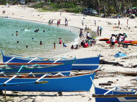 Crowded beach at Hannah's Beach Resort & Convention Center