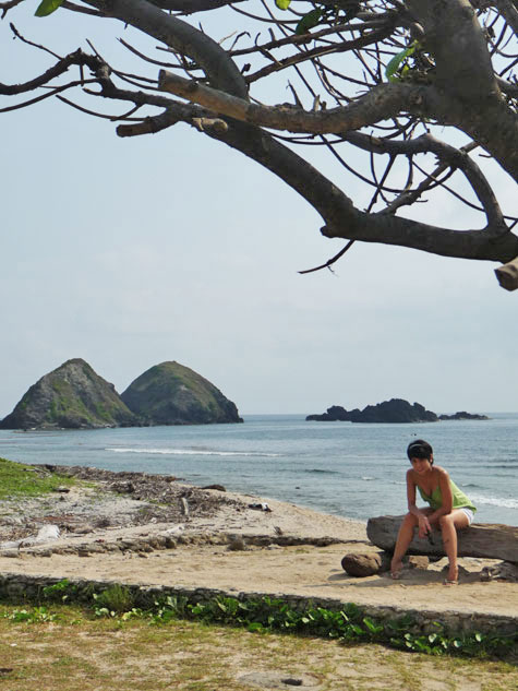 Ren posing on the beach in front of Kapuluan Vista Resort