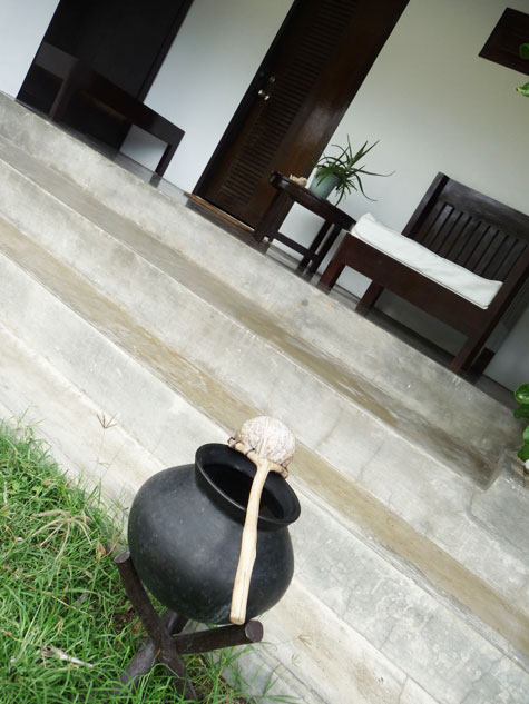 Water jug to wash your feet in front of rooms at Kapuluan Vista Resort