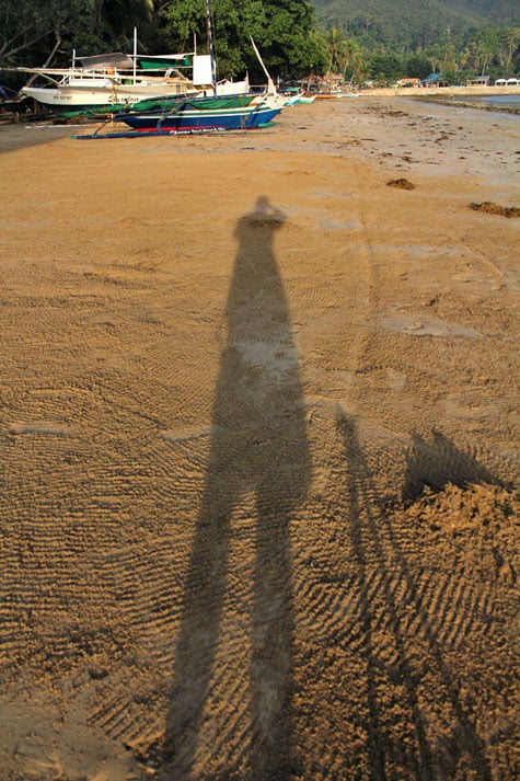 Shadow self-portrait on sand
