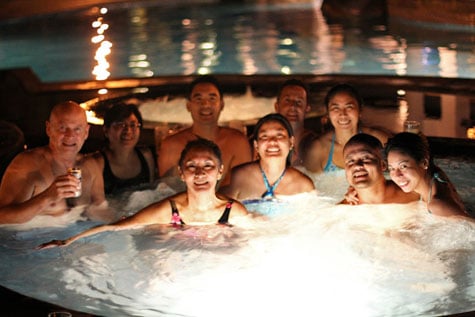 Group photo of tourists in jacuzzi