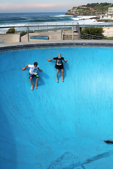 Tourists playing on an empty pool in Bondi Beach, Sydney, Australia