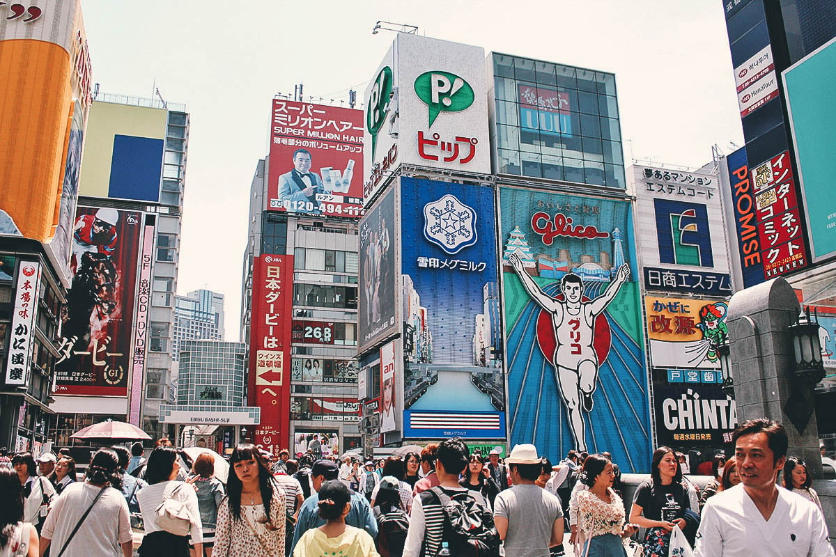 Crowds of people and Glico Man in Dotonbori, Osaka, Japan