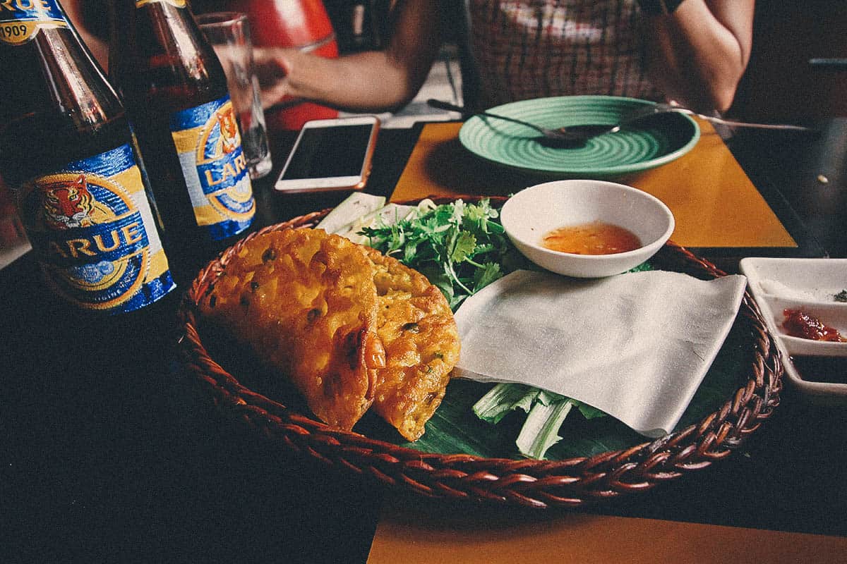 Bánh xèo with fresh herbs and bean sprouts, a delicious Vietnamese crispy crepe