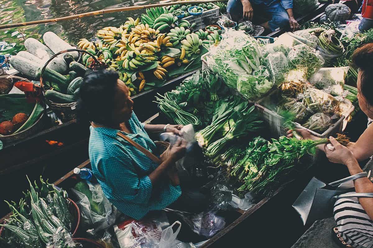 Vendor at Khlong Lat Mayom floating market in Bangkok