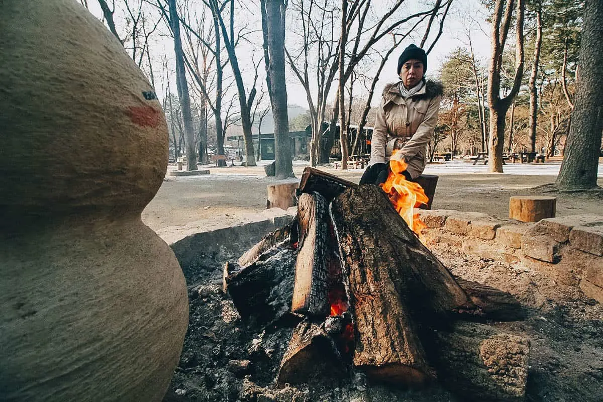 Nami Island, Chuncheon, South Korea Ren sitting at a bonfire on Nami Island in South Korea