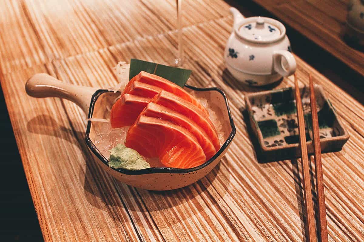 Salmon sashimi on a sushi counter at AAD in Taipei