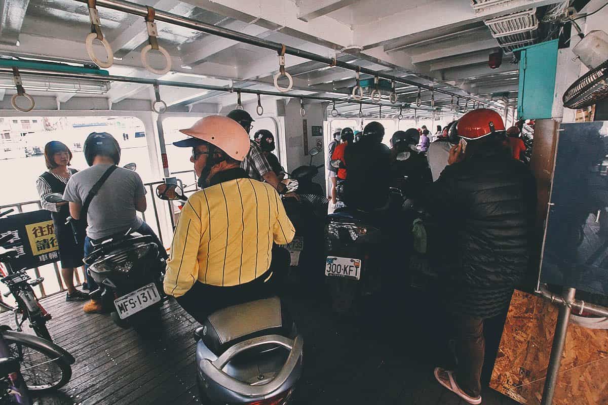Motorcyclists onboard a ferry to Cijin Island in Kaohsiung, Taiwan
