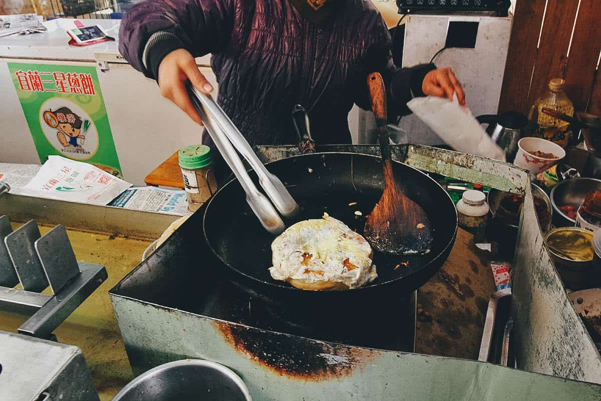 Street food vendor cooking scallion pancakes in Nantou County, Taiwan