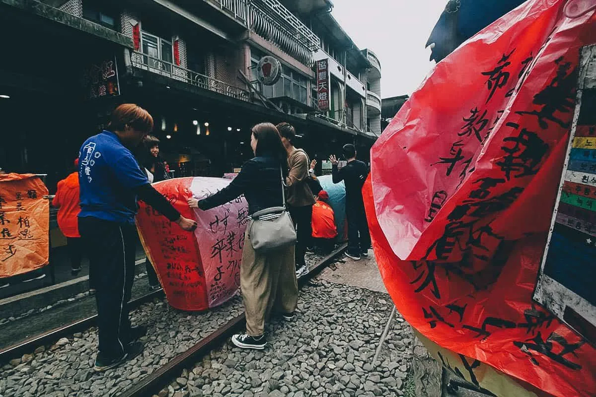 Shifen Old Street, New Taipei City, Taiwan Tourists with lanterns at Shifen Old Street, New Taipei City, Taiwan