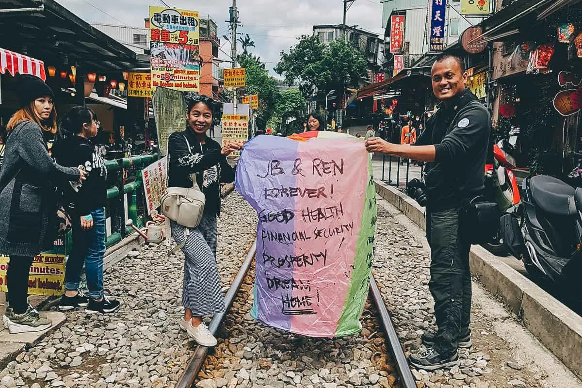Shifen Old Street, New Taipei City, Taiwan JB and Ren with a sky lantern at Shifen Old Street, New Taipei City, Taiwan