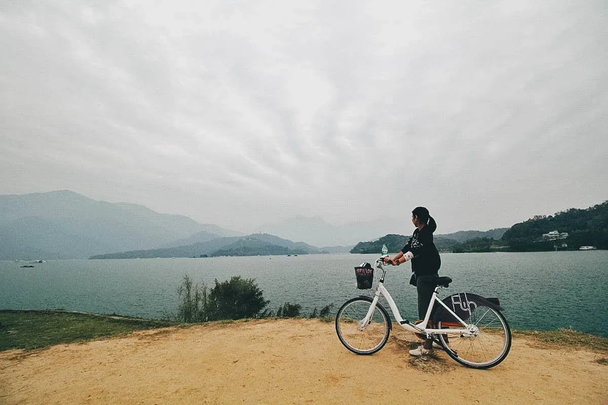Ren with her bike looking at Sun Moon Lake in Nantou County, Taiwan