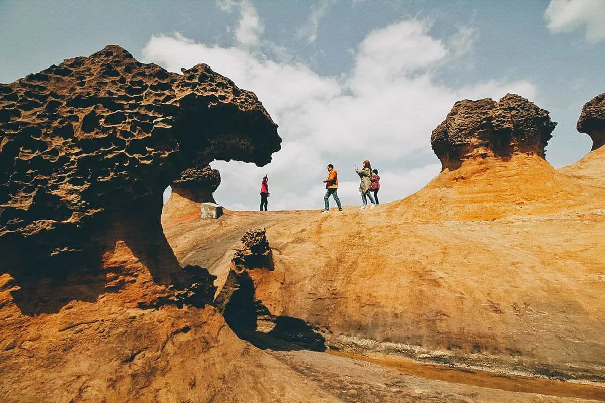 Tourists amongst rock formations at Yehliu Geopark, New Taipei City, Taiwan