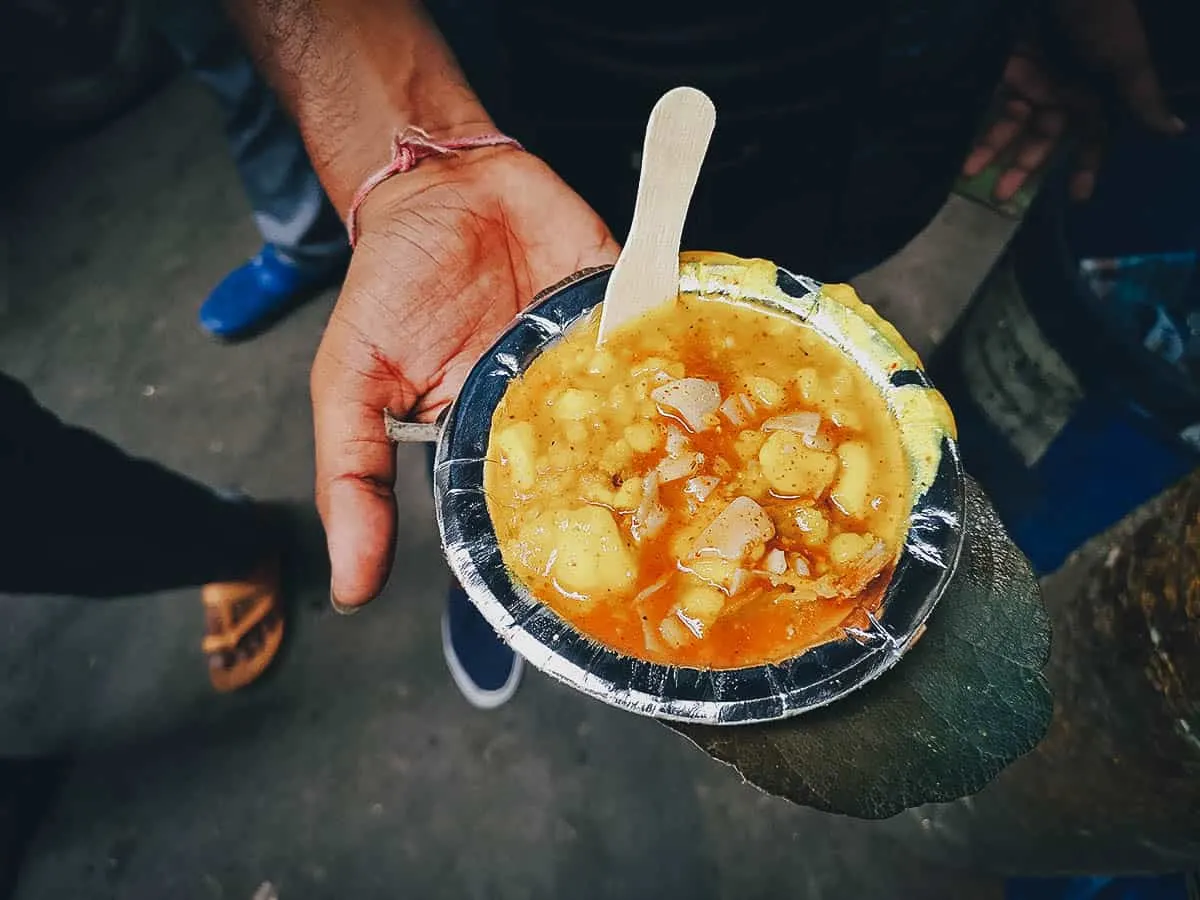 Small plate of kachori at an Indian street food stall in Delhi