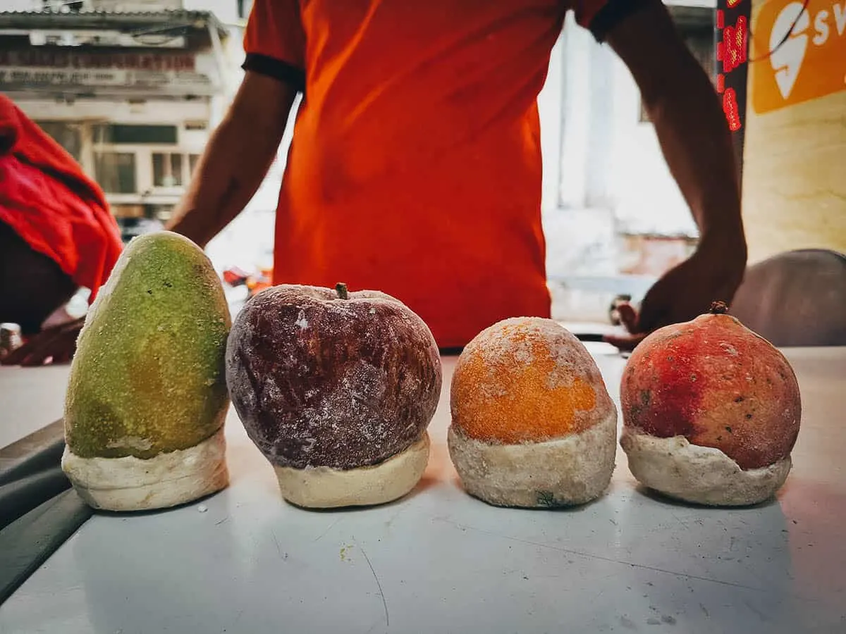 Different types of kulfi from a street food stall in Delhi