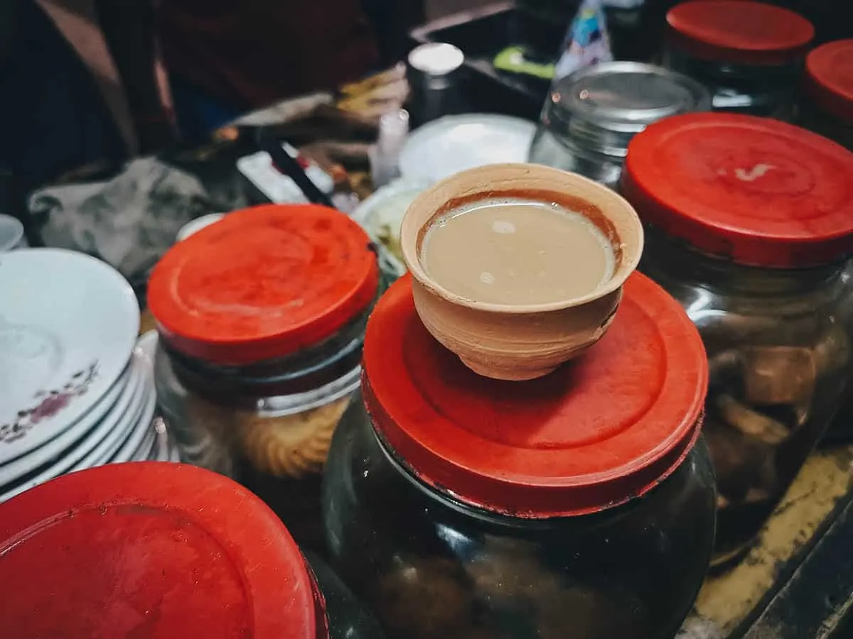 Indian Street Food Masala chai in a clay pot at an Indian street food stall in Kolkata