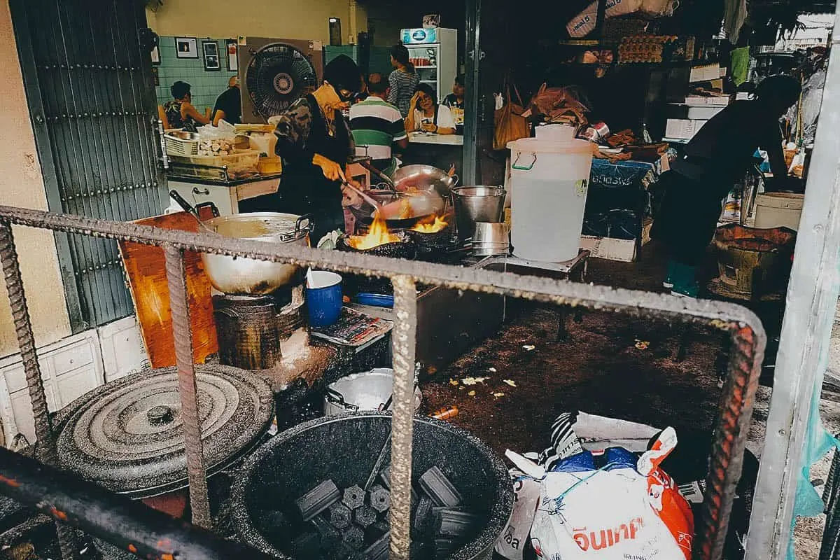 Jay Fai cooking at her restaurant in Bangkok