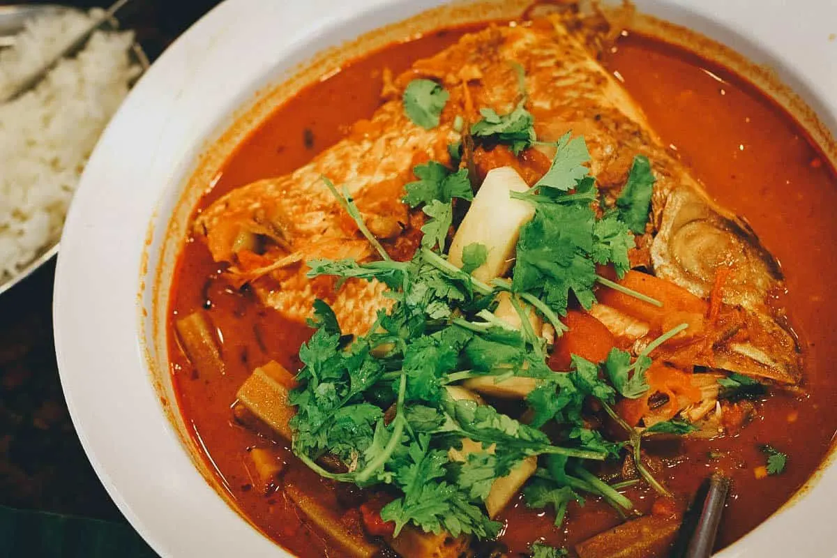 Bowl of curry fish head, a famous local South Indian-Chinese seafood dish