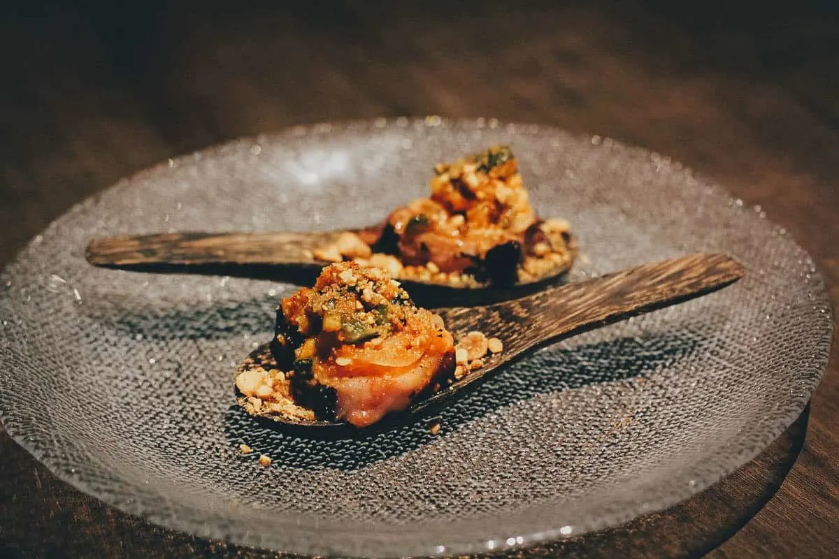 From the tasting menu: charred octopus dish on wooden spoons