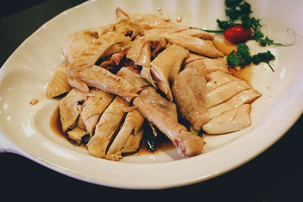 Platter of poached chicken with oily rice
