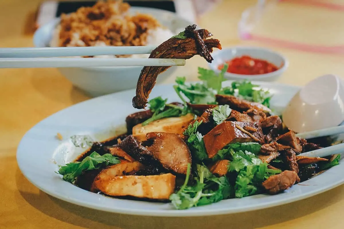 Plate of braised duck and pork belly in soy sauce