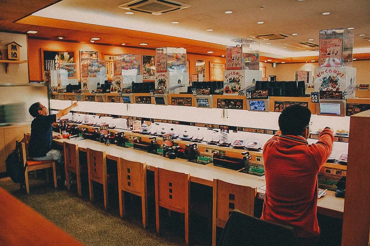 Osaka Food Guide: 25 Must-Eat Restaurants in Osaka, Japan Kura Sushi restaurant interior in Osaka, Japan