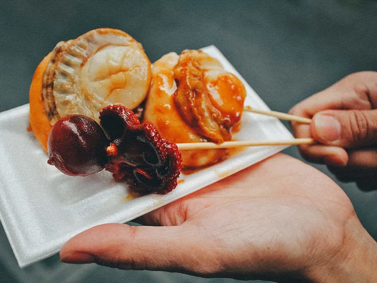 Osaka Food Guide: 25 Must-Eat Restaurants in Osaka, Japan Grilled scallops and tako tamago in Osaka