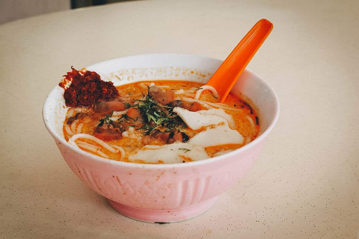 Bowl of laksa with rice noodles and sambal
