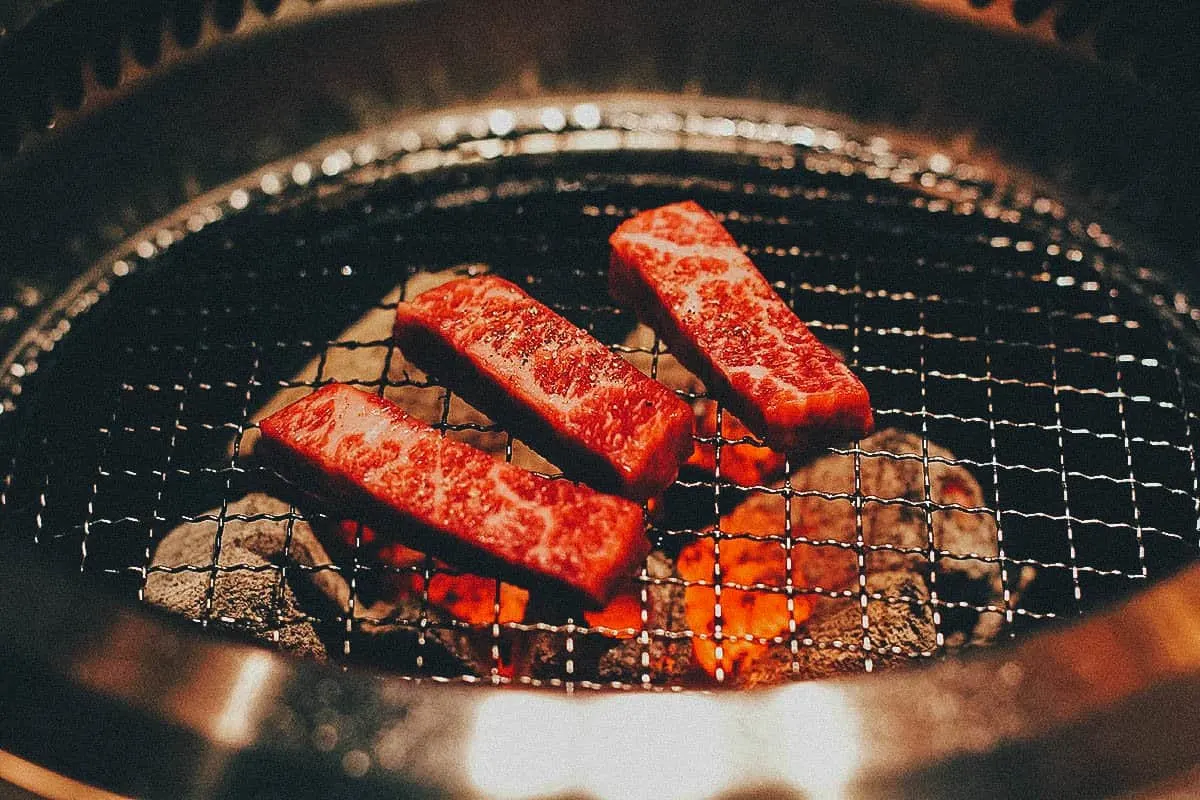 Kobe beef grilling at Tsurugyu restaurant in Osaka