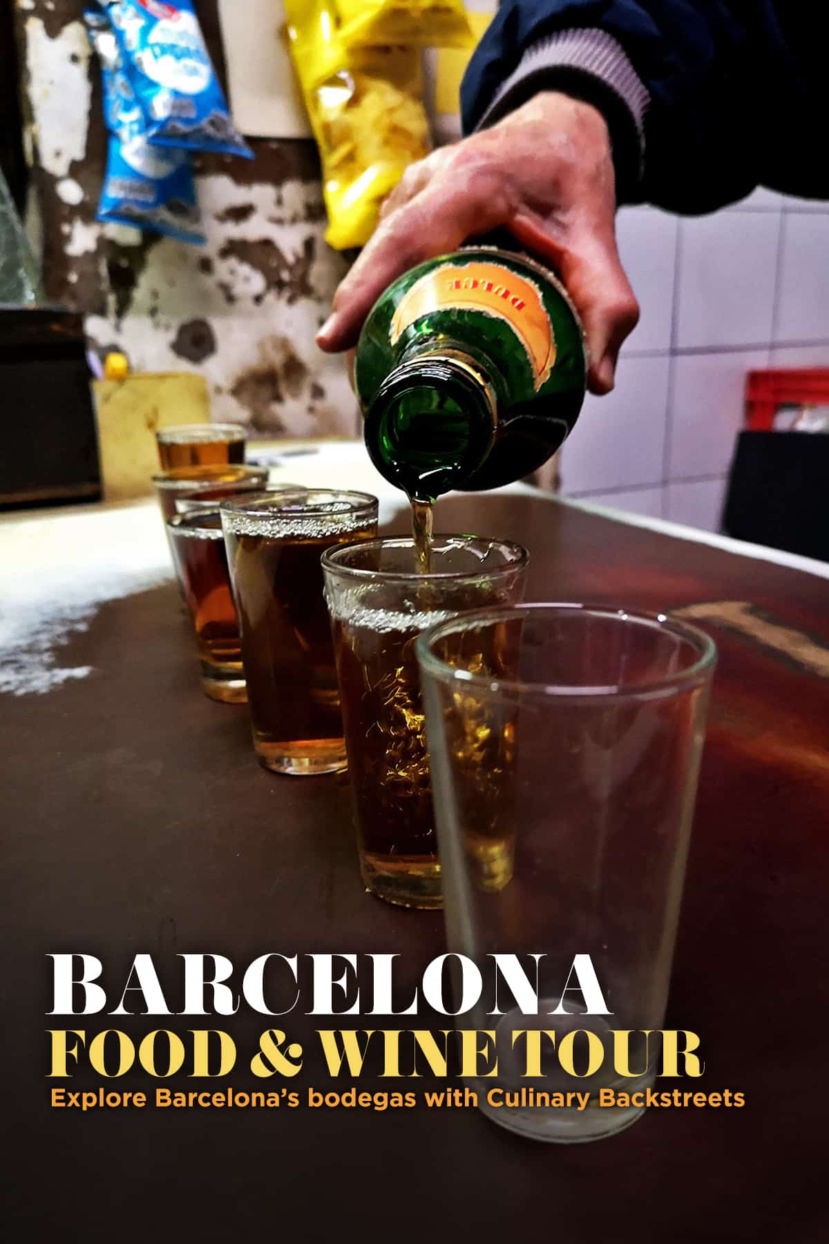 Man pouring sweet Spanish wine into glasses