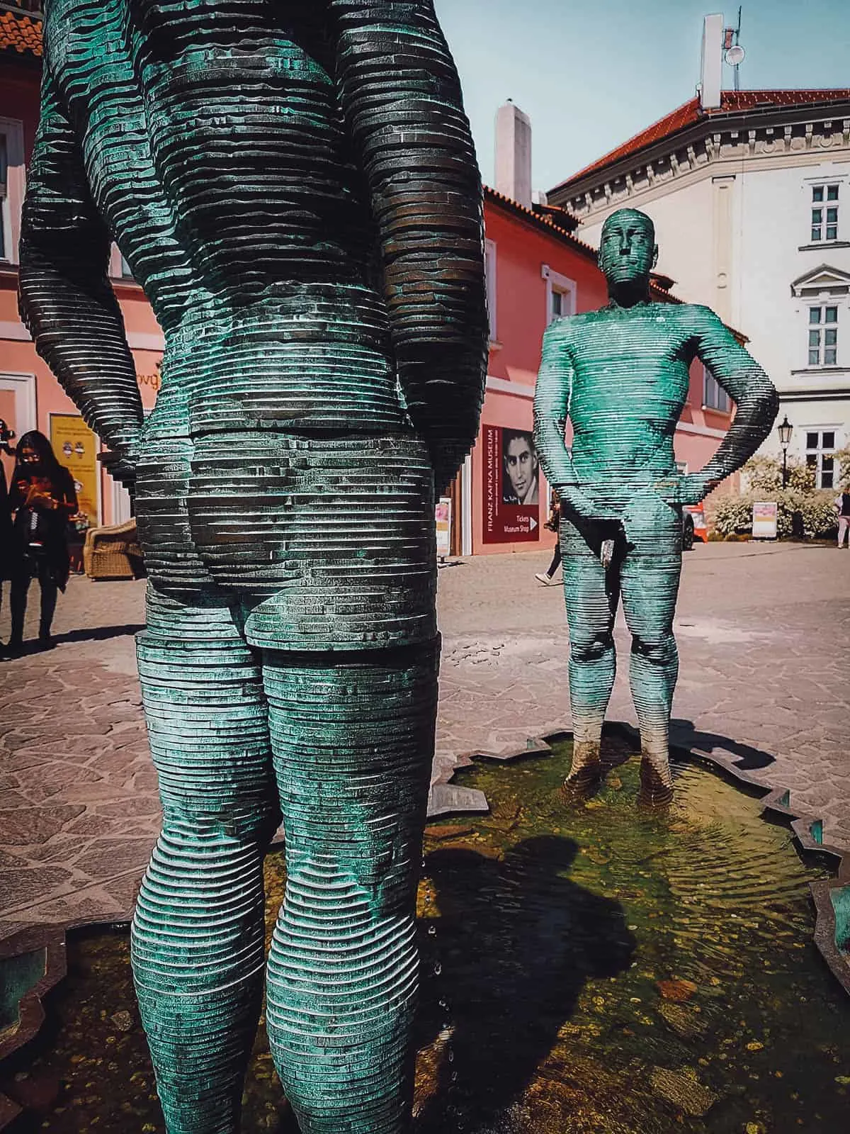 Peeing sculptures at Kafka's museum in Prague
