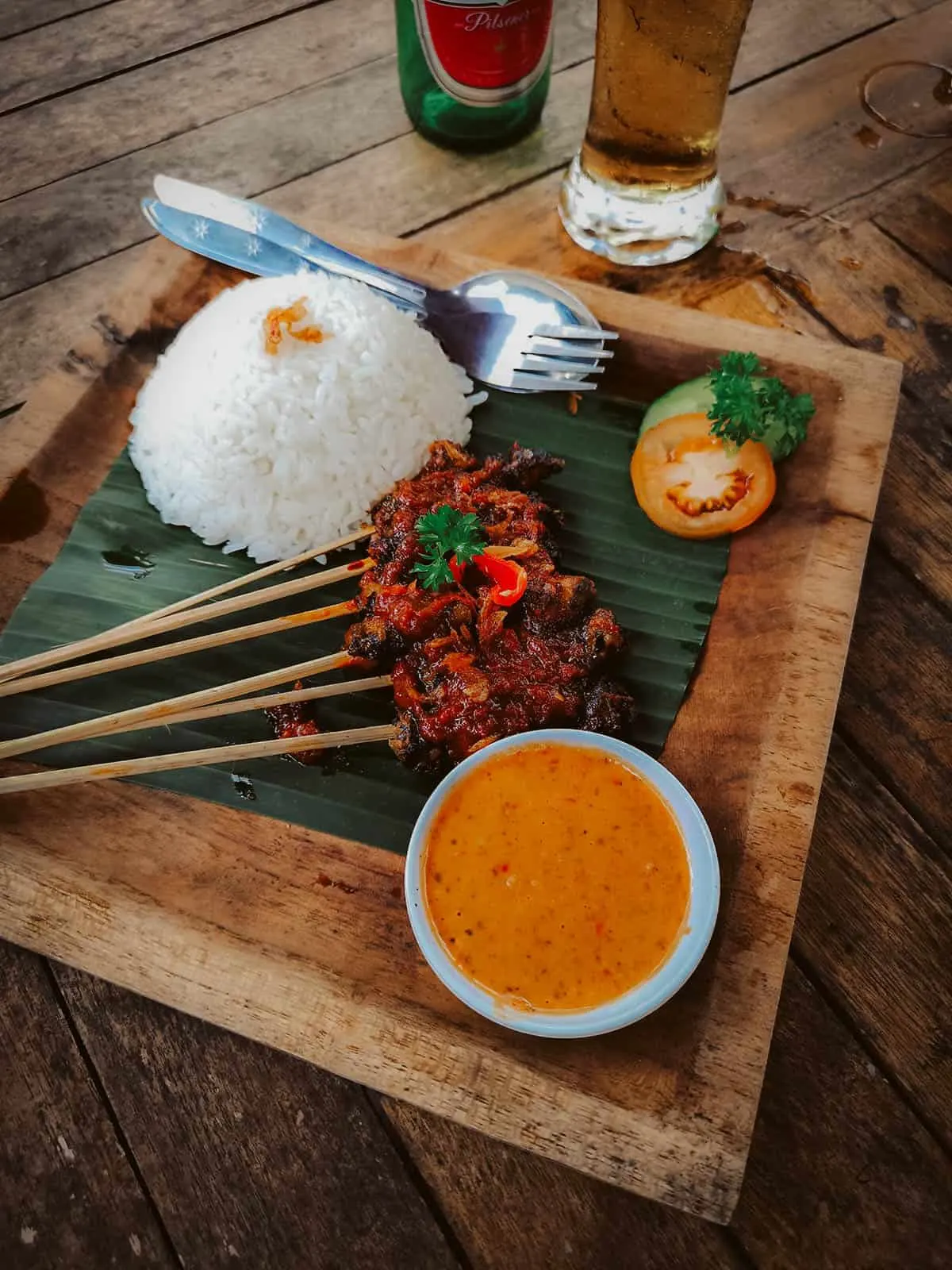 Snail satay and rice at an Indonesian restaurant in Bali