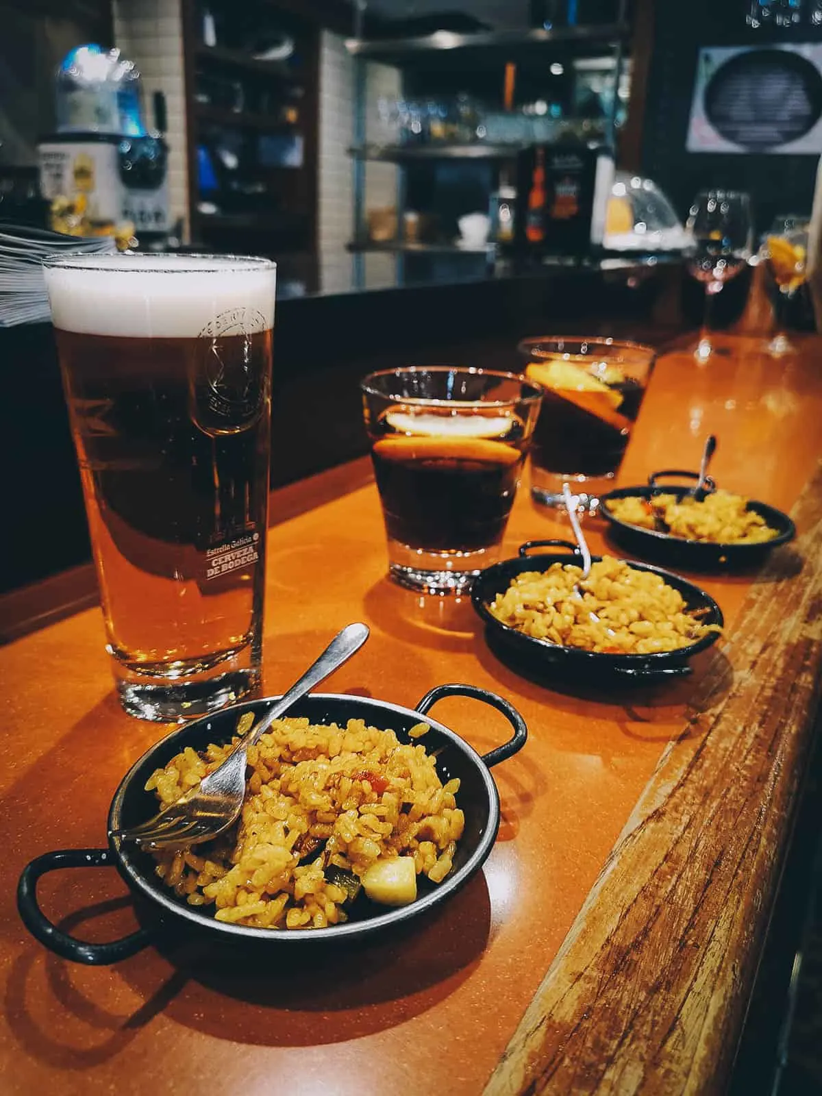 Beer and paella at La Genuina de Cimadevilla restaurant in Oviedo, Spain