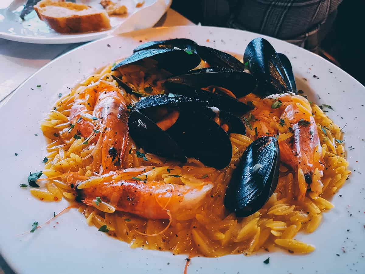 Giouvetsi, a Greek pasta dish made with kritharaki and tomato sauce