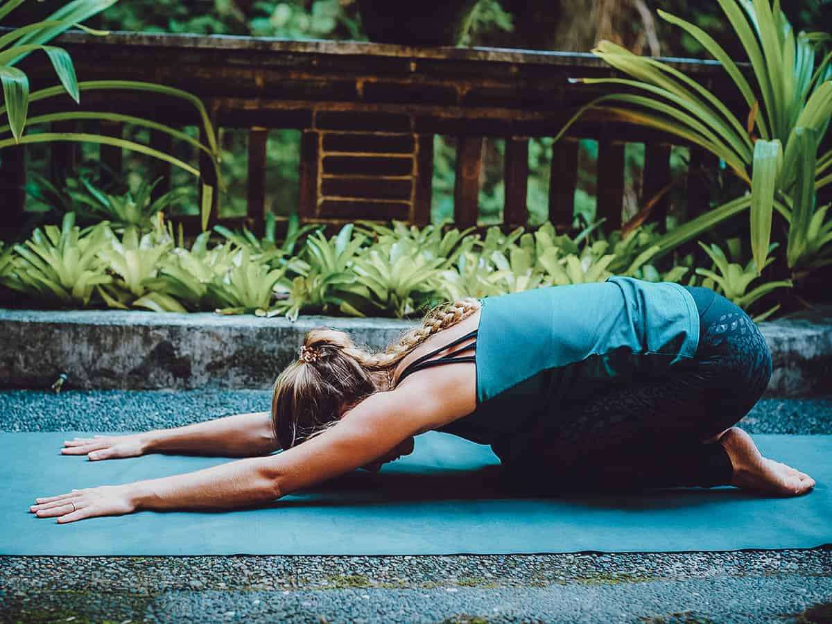 Travel guide to Ubud: Woman in child's pose