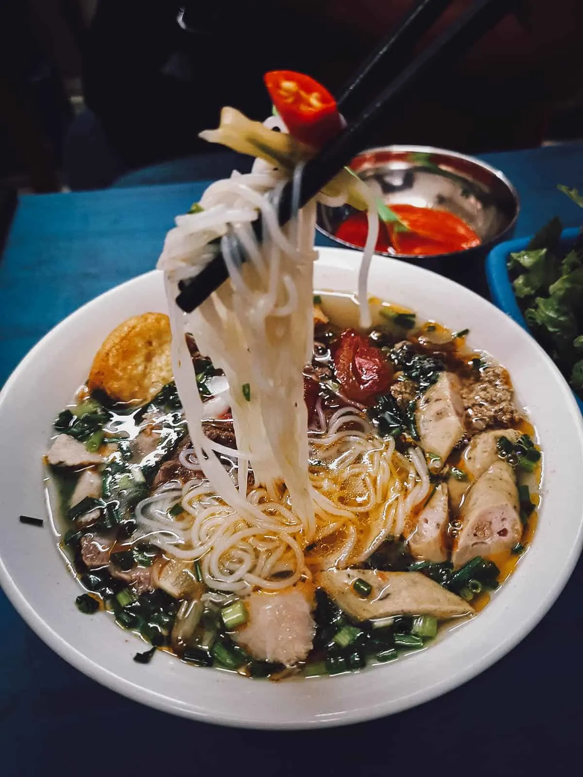 Vietnamese Food Guide: What to Eat in Vietnam Bun rieu in Hanoi, a delicious Vietnamese noodle soup made with crab