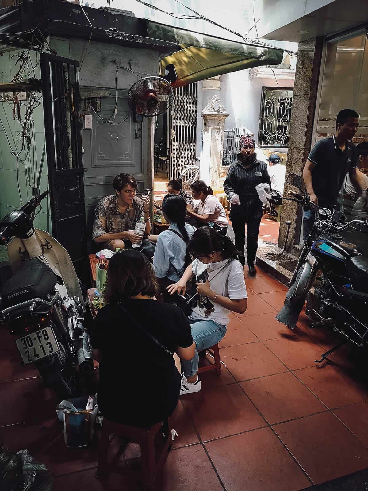 Seating at Bun Cha 74 Hang Quat restaurant in Hanoi