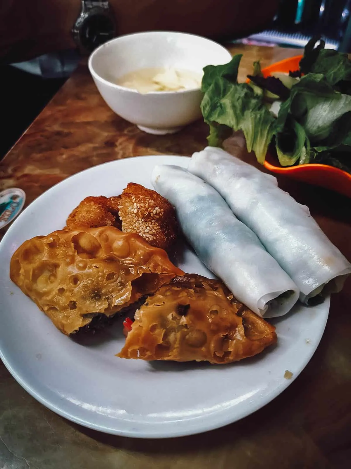 Deep-fried fritters and pho roll at Quán Gốc Đa restaurant in Hanoi