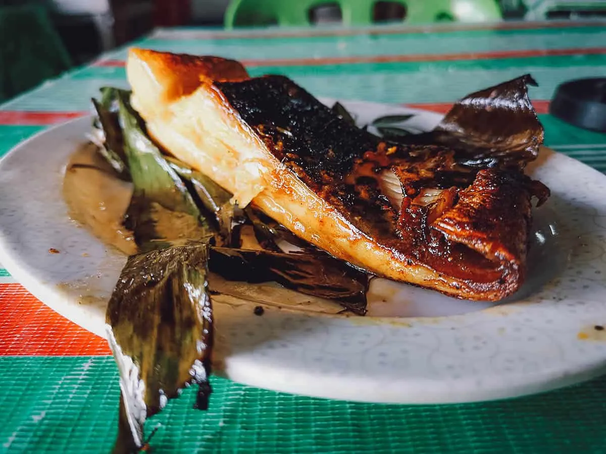 Popular seafood dish of stingray cooked with sambal and wrapped in banana leaves