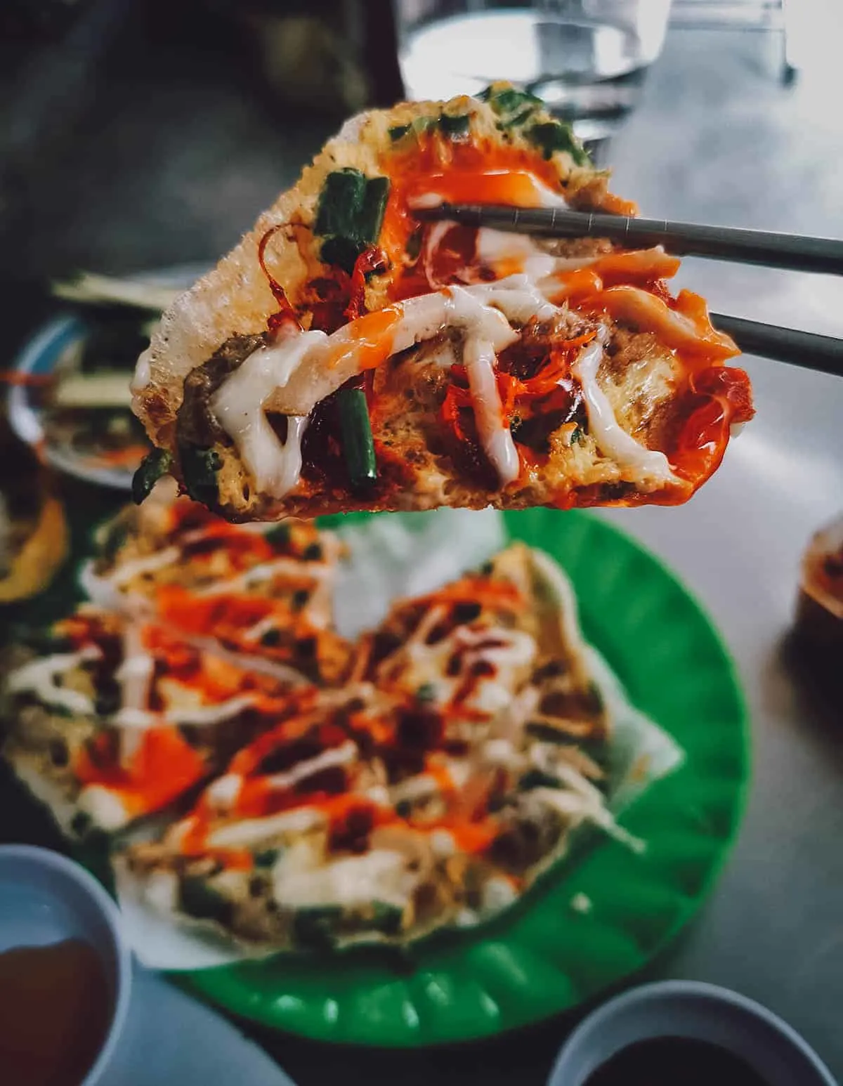 Banh trang trung or grilled rice paper at a restaurant in Hue