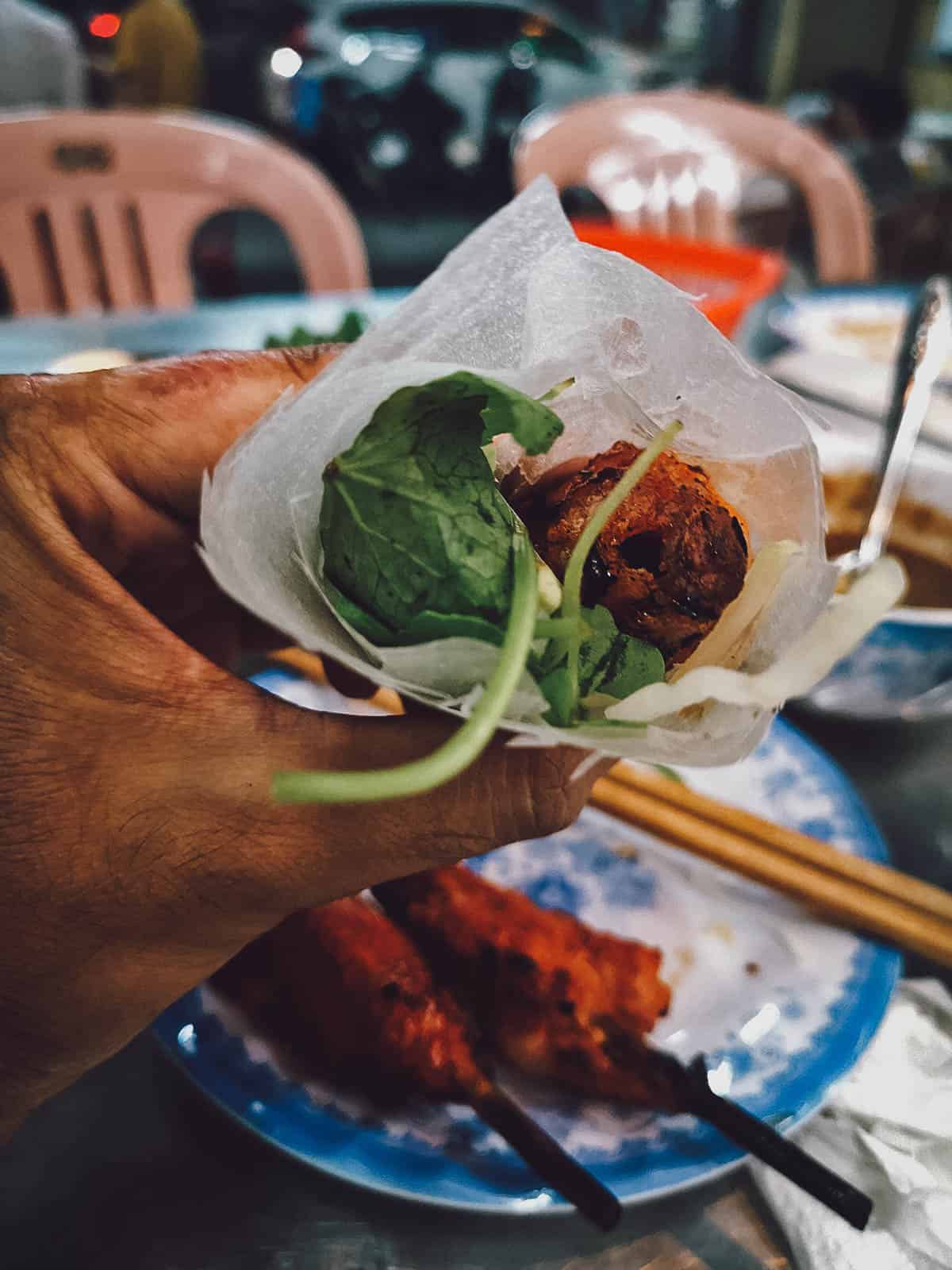 14 Must-Eat Restaurants & Street Food Stalls in Hue, Vietnam Nem lui wrapped in rice paper at Tai Phu restaurant in Hue