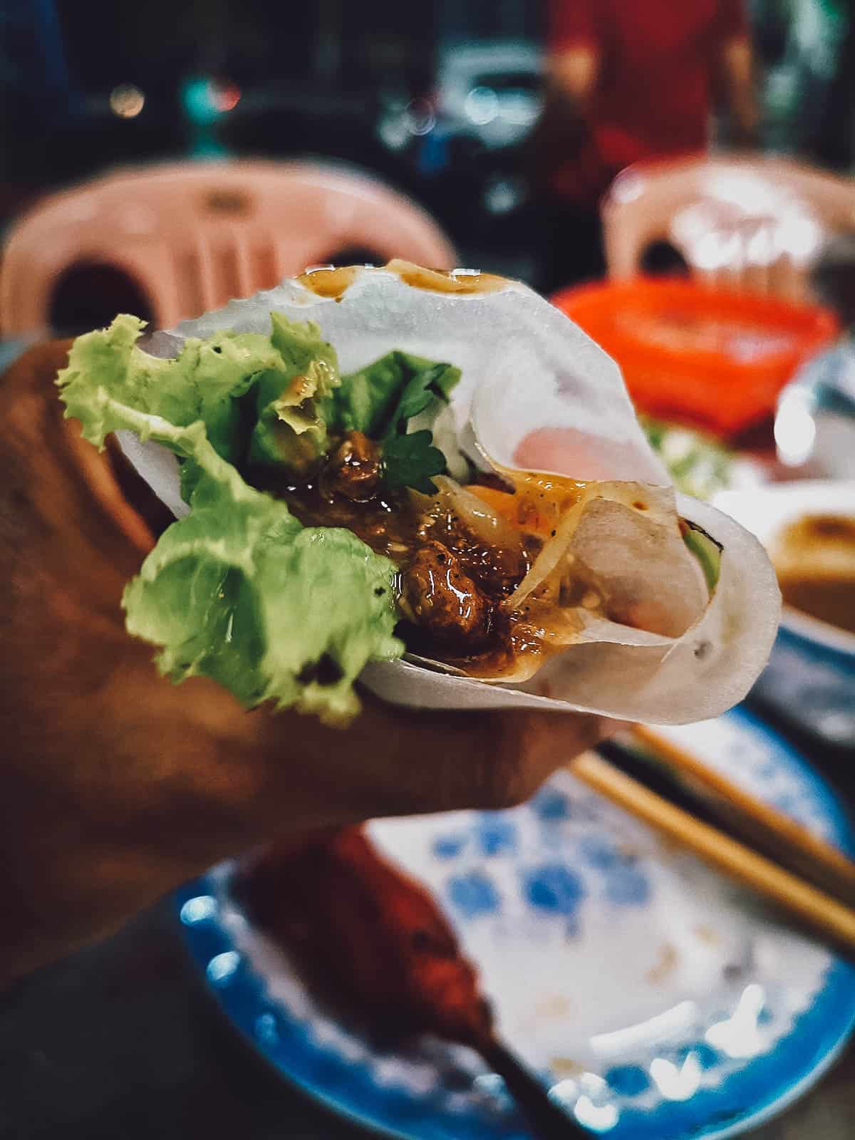 14 Must-Eat Restaurants & Street Food Stalls in Hue, Vietnam Nem lui wrapped in rice paper at Tai Phu restaurant in Hue