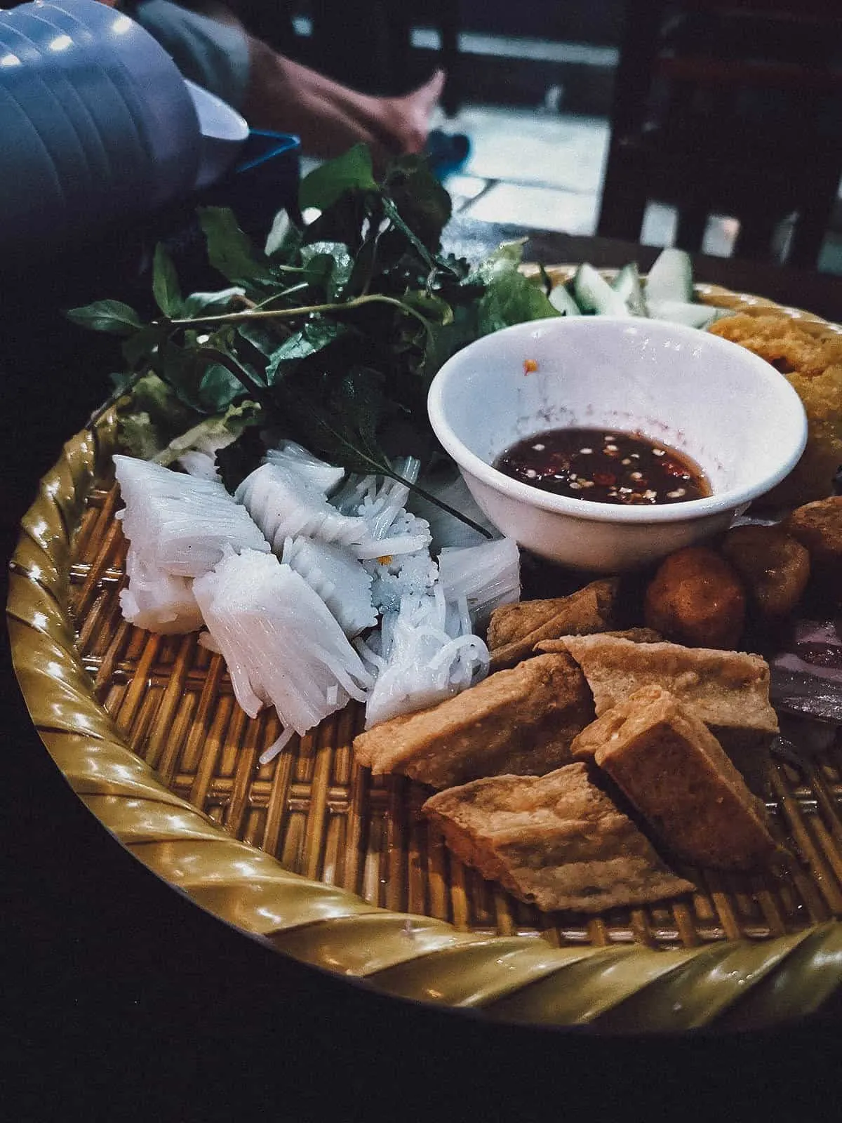 Bun dau mam tom in Hanoi, an interesting Vietnamese noodle dish served with bunched up rice noodles, fried tofu, and fermented shrimp sauce