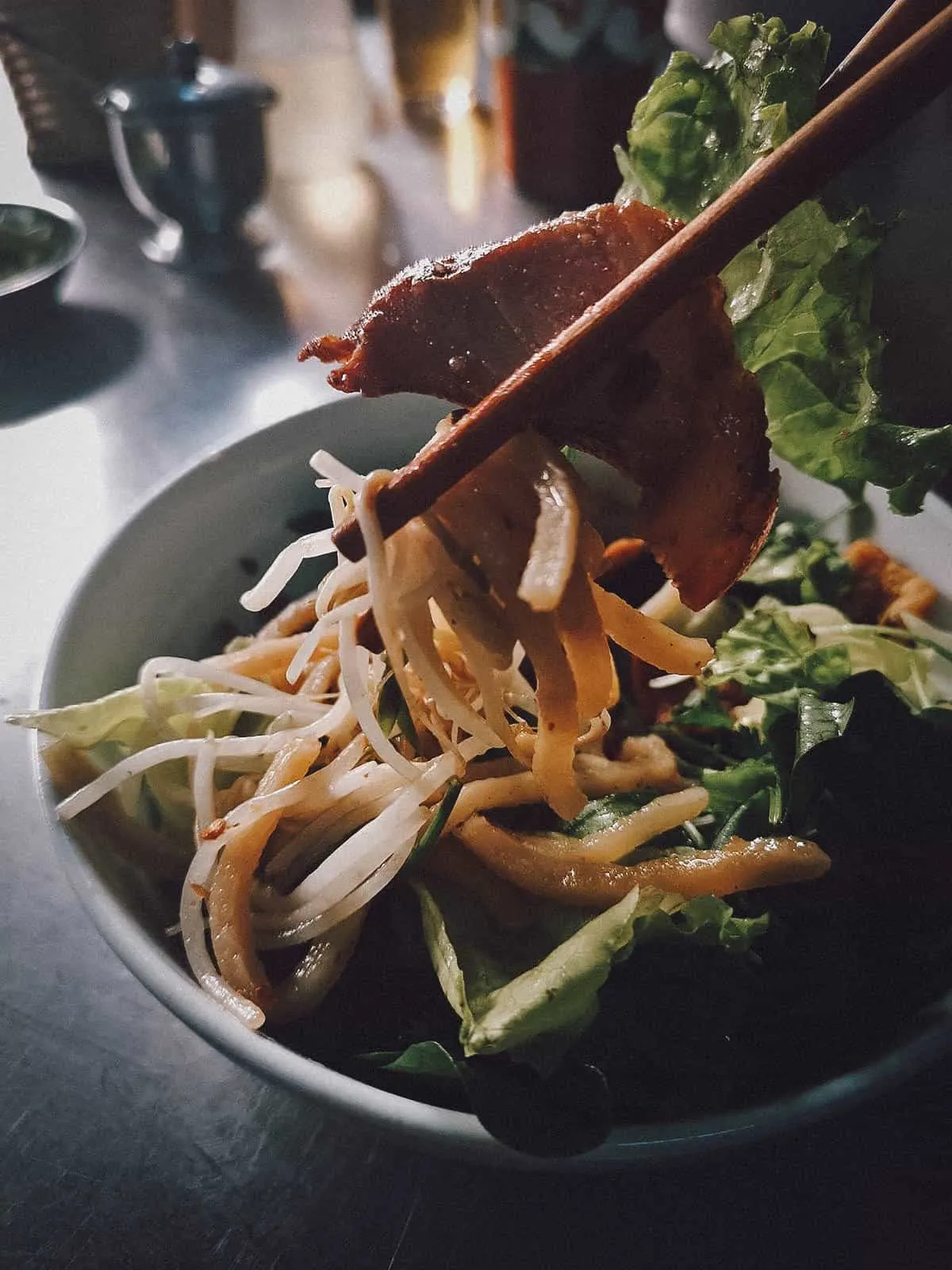 Slice of grilled pork at Cao Lau Thanh restaurant in Hoi An, Vietnam