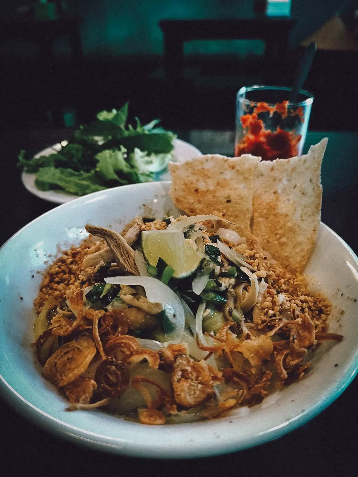 Vietnamese Food Guide: What to Eat in Vietnam Mi quang, a popular regional Vietnamese food in Da Nang made with rice noodles, meat, and bone broth