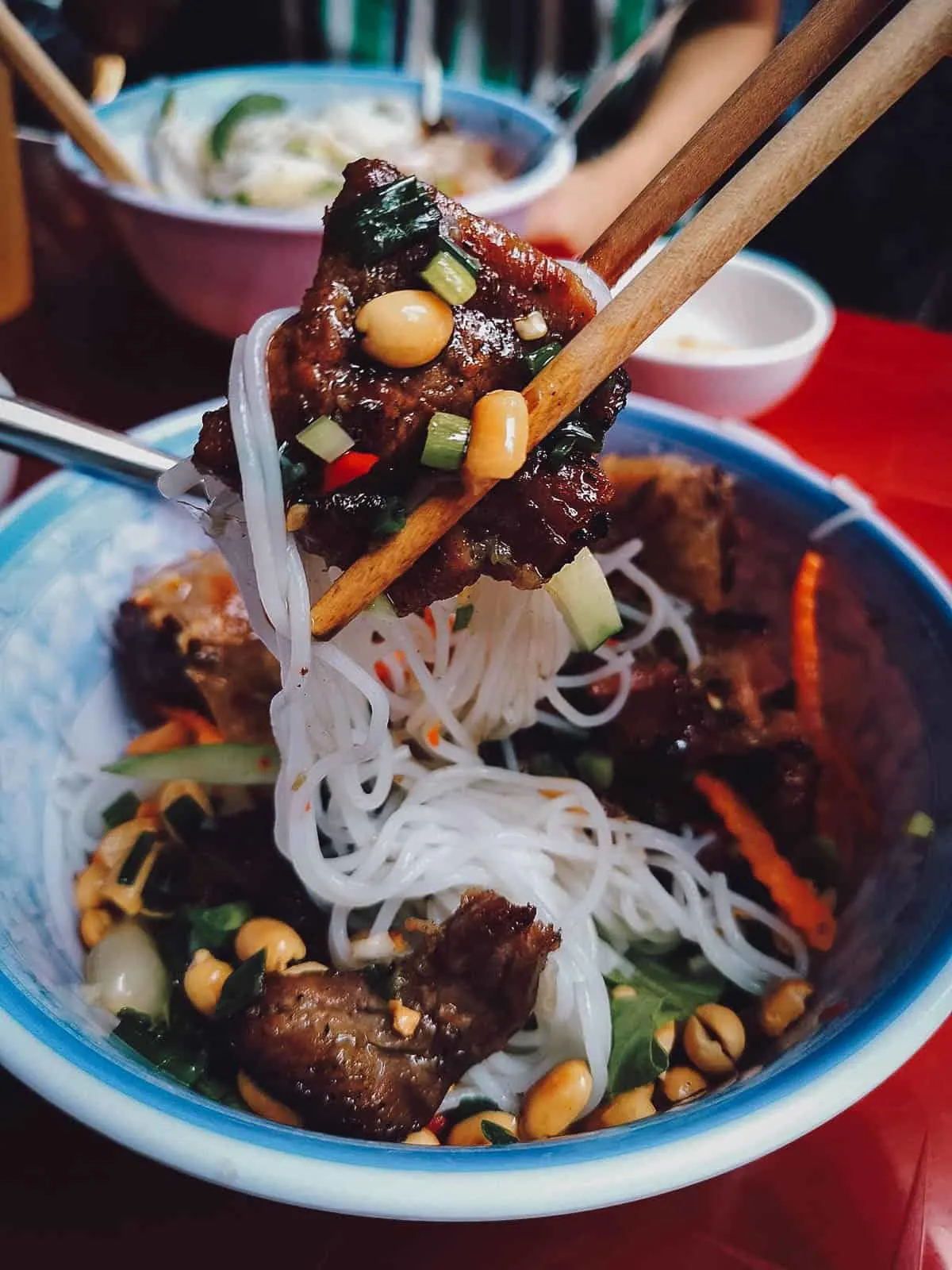 Vietnamese Food Guide: What to Eat in Vietnam Bun thit nuong in Saigon, a delicious Vietnamese pork noodle dish similar to bun cha
